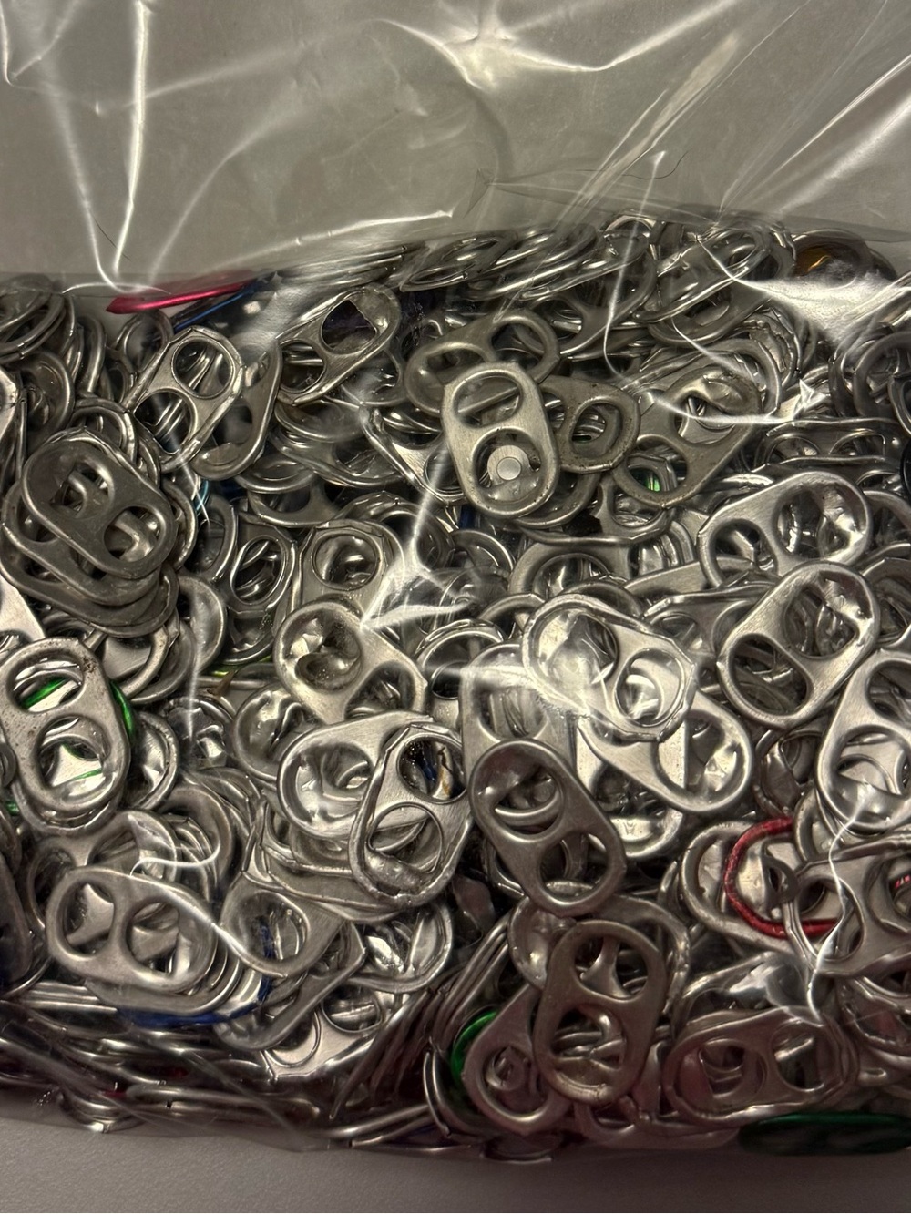 10 OZ pop tabs (approximately 1,000 tabs)